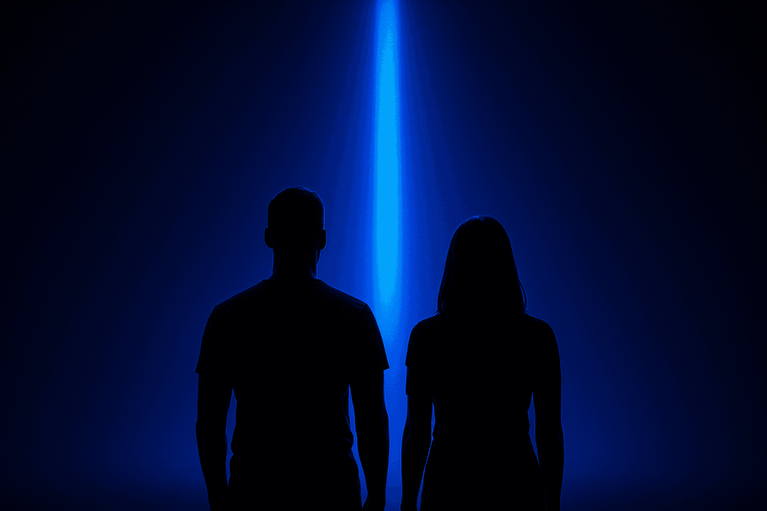Two people watching a column of light in a bright server hall
