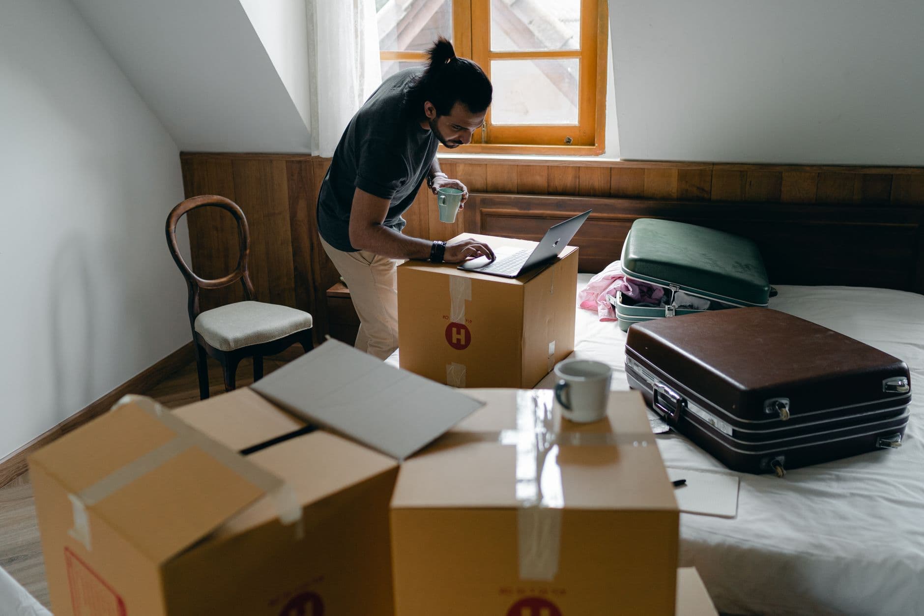 Boxes and a laptop symbolizing a free site transfer to a new host