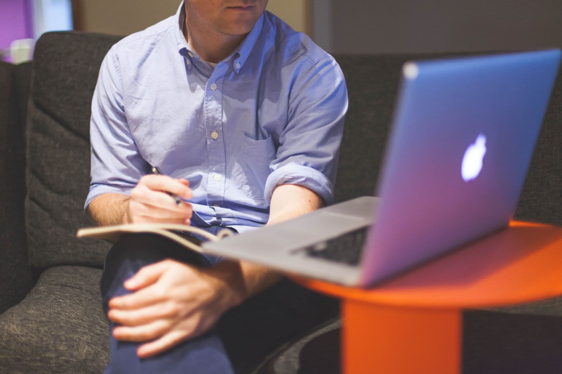 Entrepreneur at a laptop running a reseller hosting business
